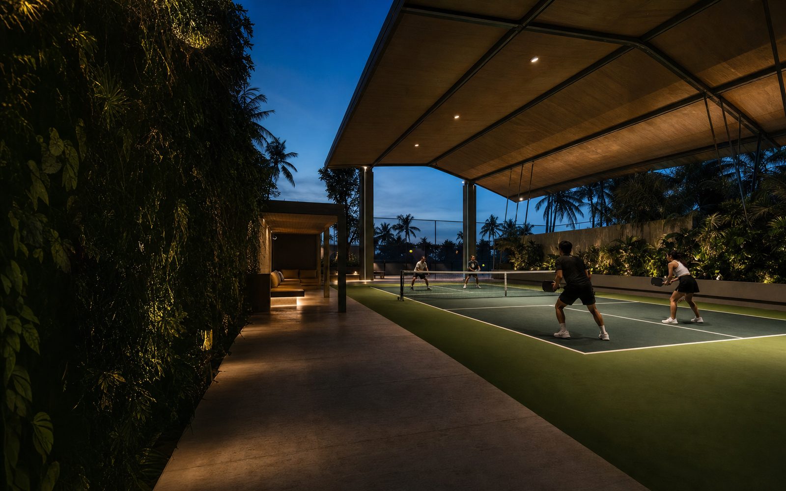 Players enjoying an evening match on a covered tropical pickleball court